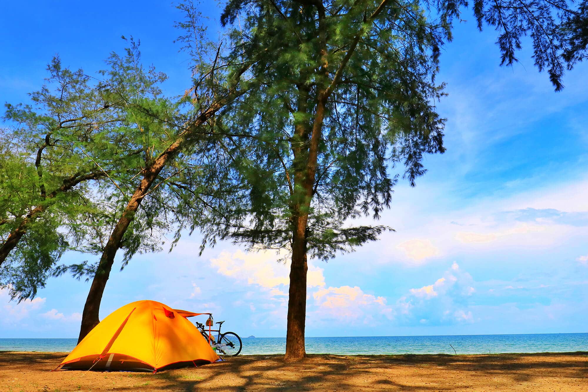 Small tent in hot summer weather near ocean Featured