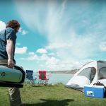 Zero-breeze-2-camper-walks-to-his-tent-during-day-to-start