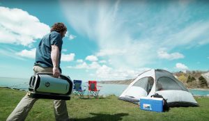 Zero-breeze-2-camper-walks-to-his-tent-during-day-to-start