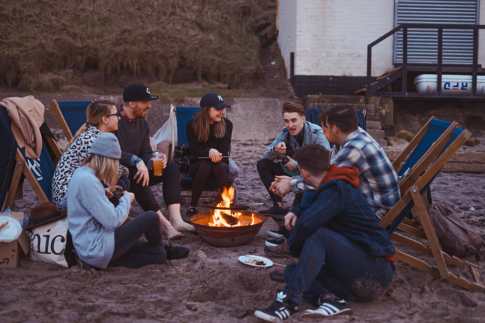 group of young friends campfire